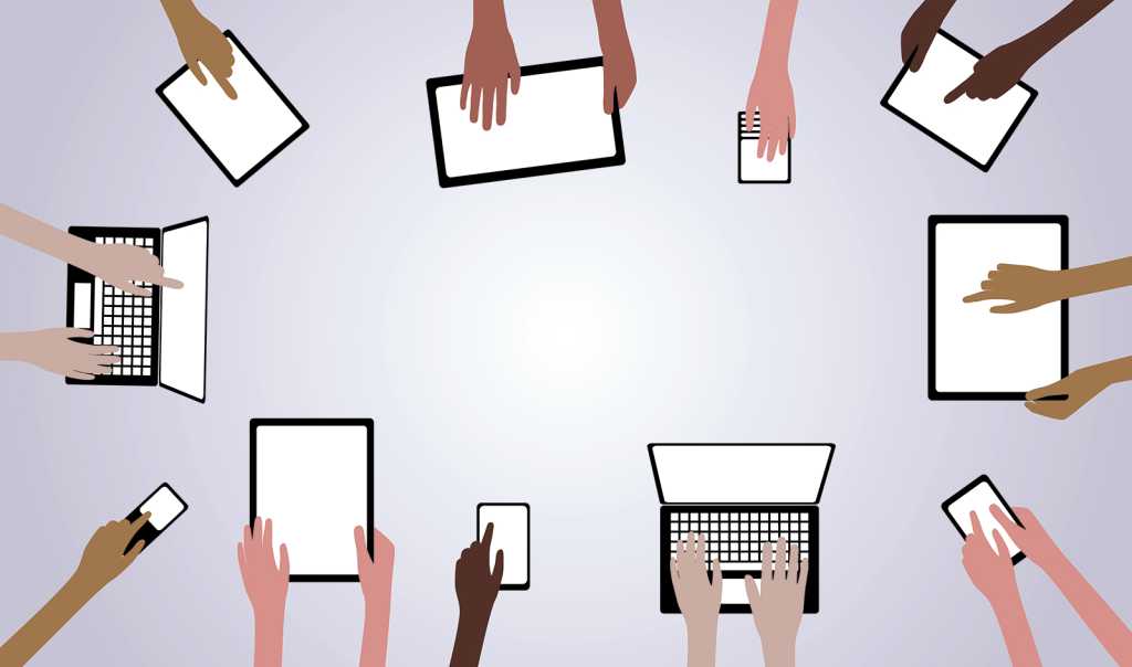 illustration of several employee hands on laptops tablets and phones